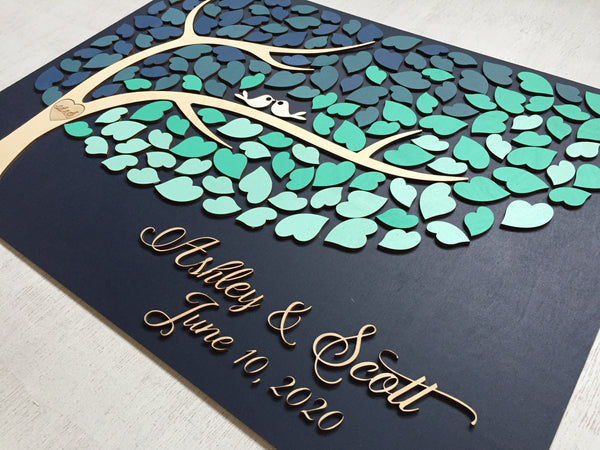 detail of ombre guest book alternative with tree of life and blue color scheme