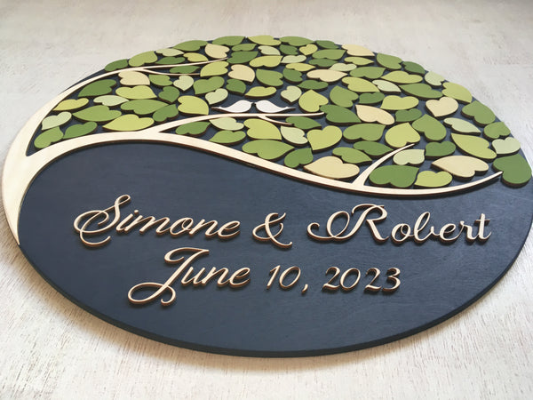 detail of round guest book alternative one tree green leaves