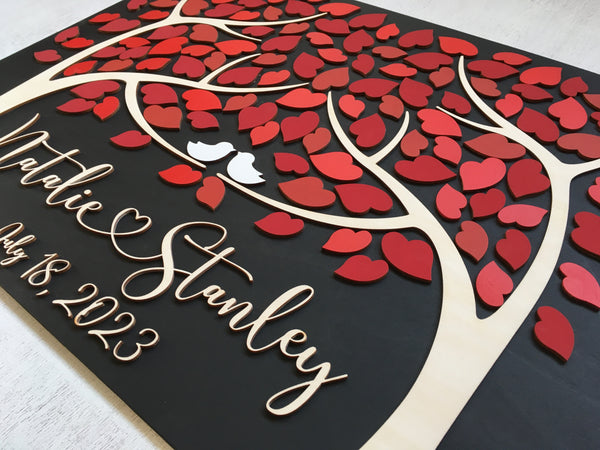 guest book made with red shades for the leaves suitable for a fall wedding or to add a splash of color to your wedding decor