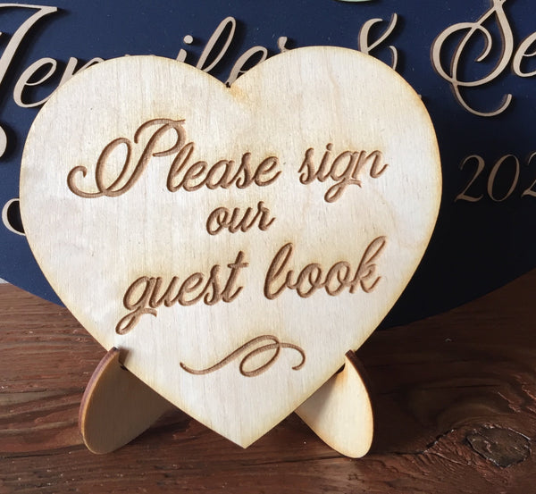 The little sign measures 5"x5", comes with a stand and is made of engraved wood