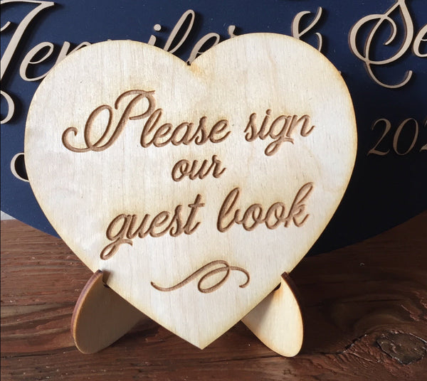 the little sign can be added to direct your guests to sign the guest book