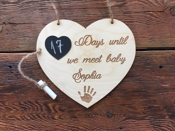 The wood sign is customized with your baby's name and comes with a little heart chalkboard and a piece of chalk