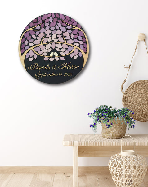 round guest book with purple lavender fading effect shown on a wall as home decor made by SignYouStyle