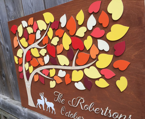 side view of fall guest book alternative with deer couple and red orange yellow leaves 