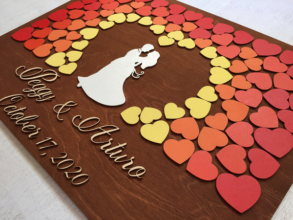 The names and date of the wedding are placed underneath the couple and the hearts and are cut from 3D wood. The guest book is personalized fr each couple in part and the colors can be changed, each guestbook is manually painted and color requests can be made.