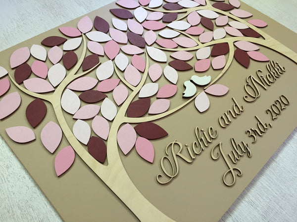 detail showing the pink, blush and cherry blossom leaves with burgundy accents on a guest book made by SignYouStyle