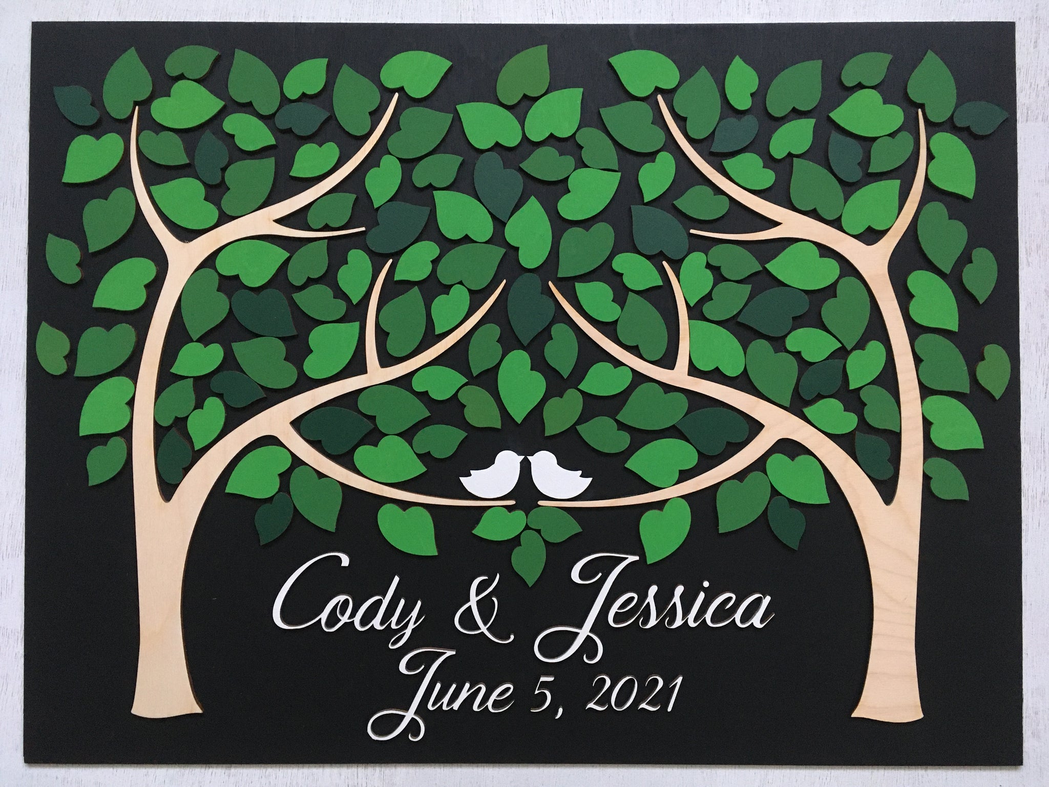 signyoustyle guest book alternative with green leaves and two trees