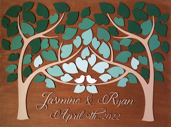 the alternative guest book is made with the names of the bride and groom in fancy cutout lettering plus the wedding date accompanied by the colors chosen for the wedding decor and guest book sign
