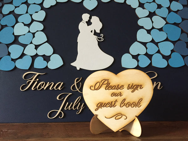 the heart sign asks the guests to sign the guest book