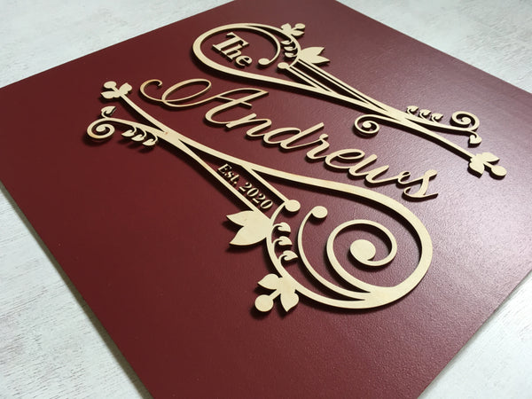 the last name is laser cut with precision and features a number of swirls and vintage style motifs