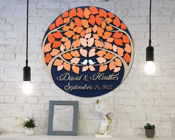 the round shaped guest book alternative with trees and orange leaves shown in a home decor setting