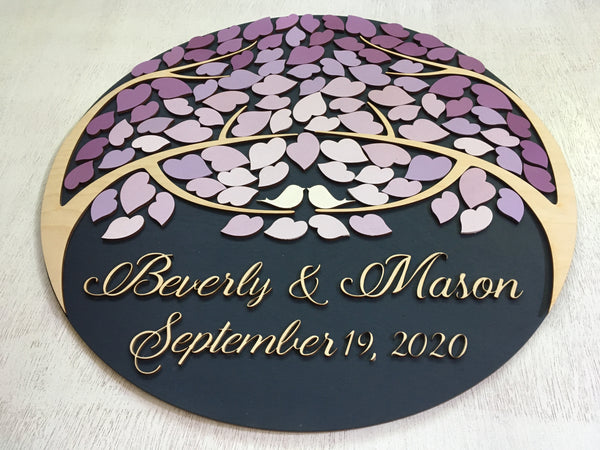 the text is custommized and applied in calligraphic font on this round guestbook in purple shades signyoustyle.com