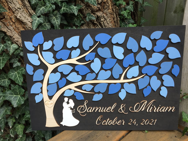 the tree of hearts can be personalized with your wedding colors this example shows shades of blue for the leaves