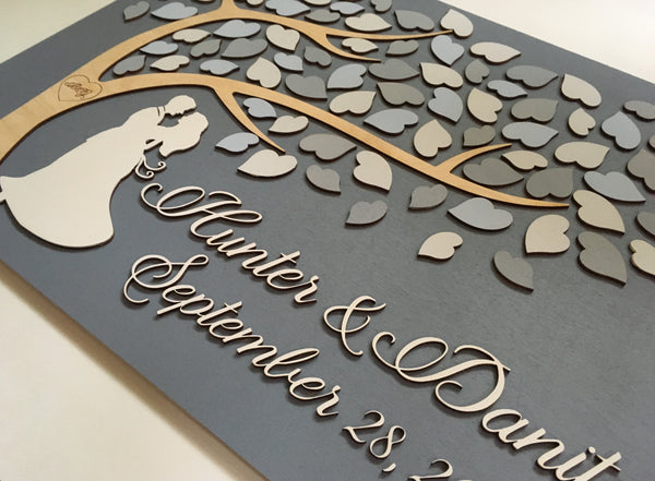 wood wedding guest book with shades of grey and dancing couple